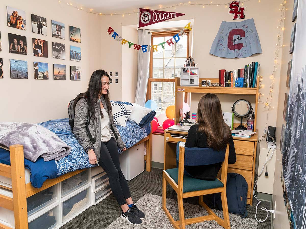 Two students chat in a student bedroom in one of ɫTV's Residential Commons